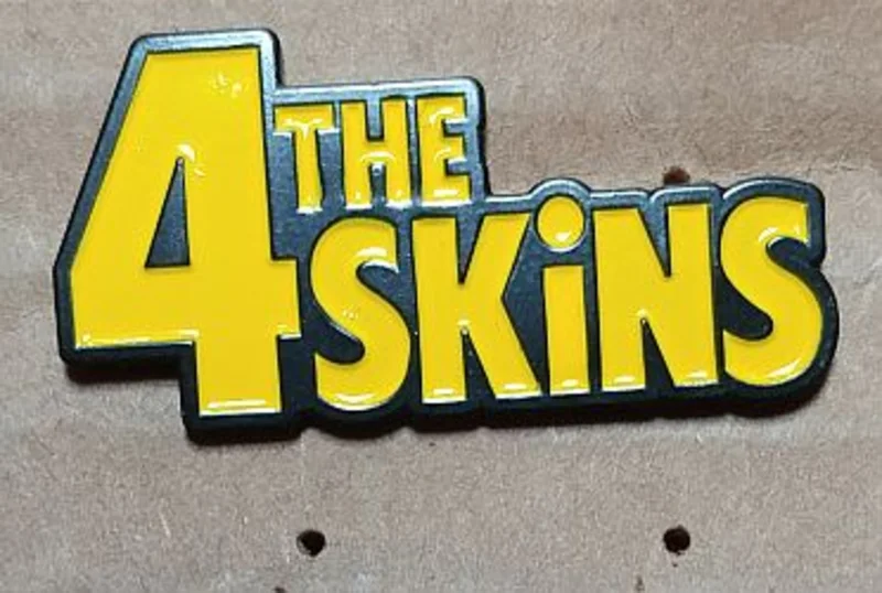 4 SKINS, THE ENAMEL BADGE