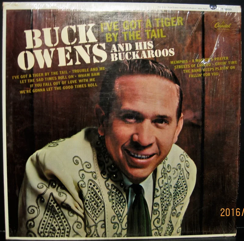 Buck Owens & His Buckaroos - I've Got A Tiger by The Tail