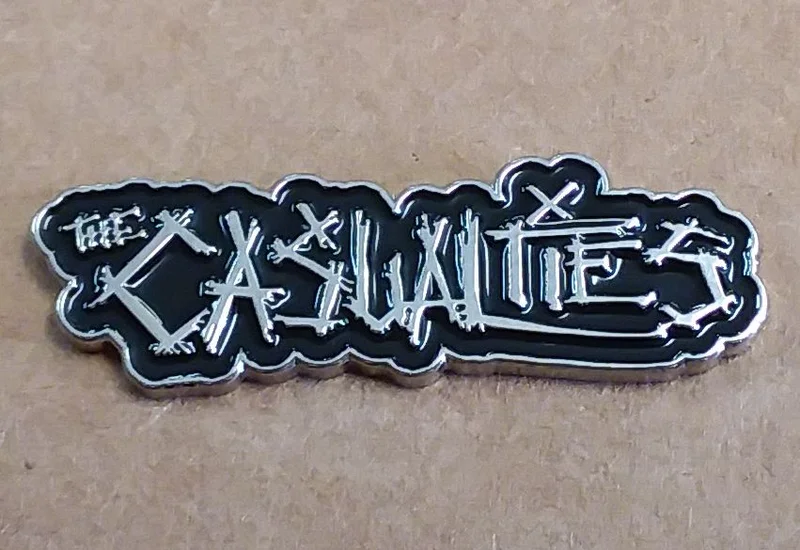 CASUALTIES LOGO ENAMEL BADGE