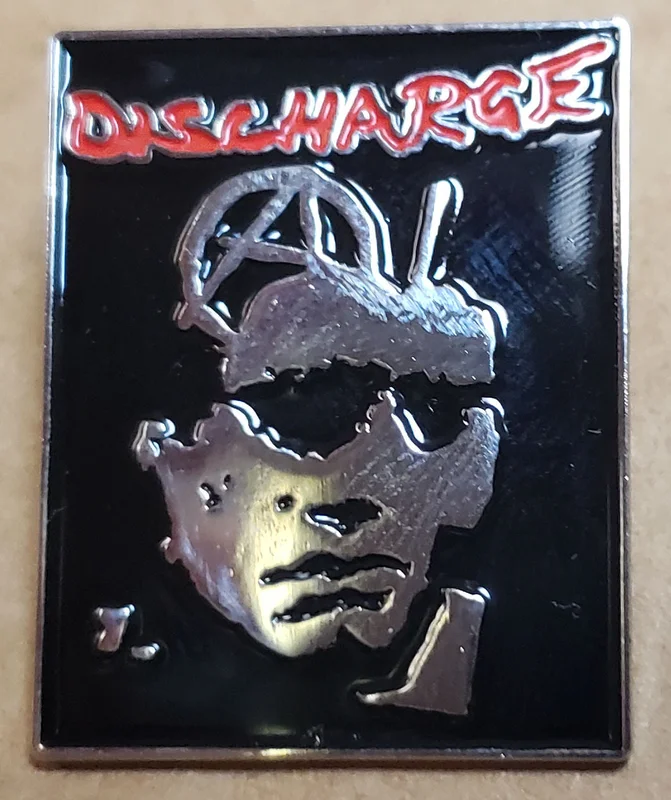 DISCHARGE ENAMEL BADGE