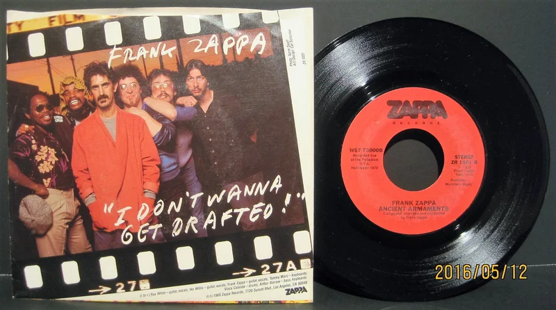 Frank Zappa - I Don't Wanna Get Drafted b/w Ancient Armaments (Live 1978)